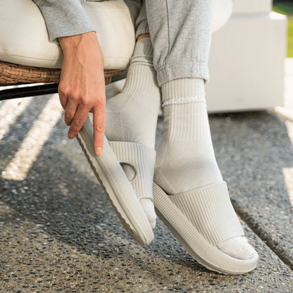 Grey slip-ons on outdoor patio